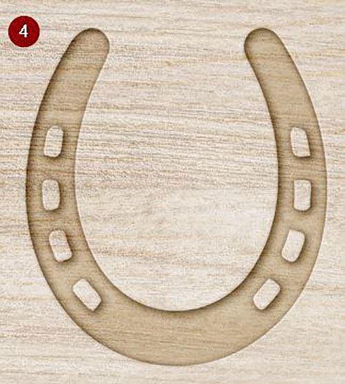 Mock up of wooden horseshoe decoration with a rustic finish on a light wood grain background