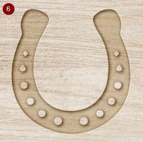 Mock up of wooden horseshoe decoration with a rustic finish on a light wood grain background