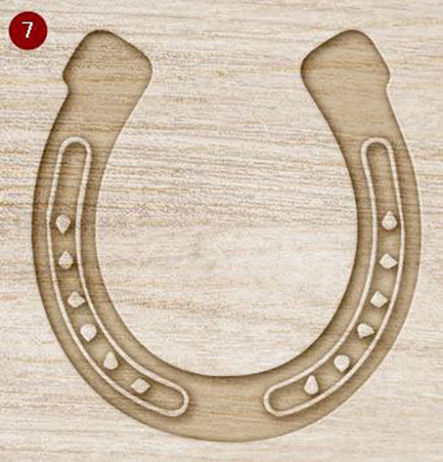 Mock up of wooden horseshoe decoration with a rustic finish on a light wood grain background