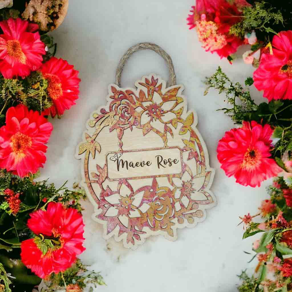 Personalized round nursery door hanger with custom baby name