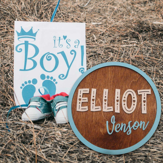 Personalized Round Name Sign presented as a gift for new parents