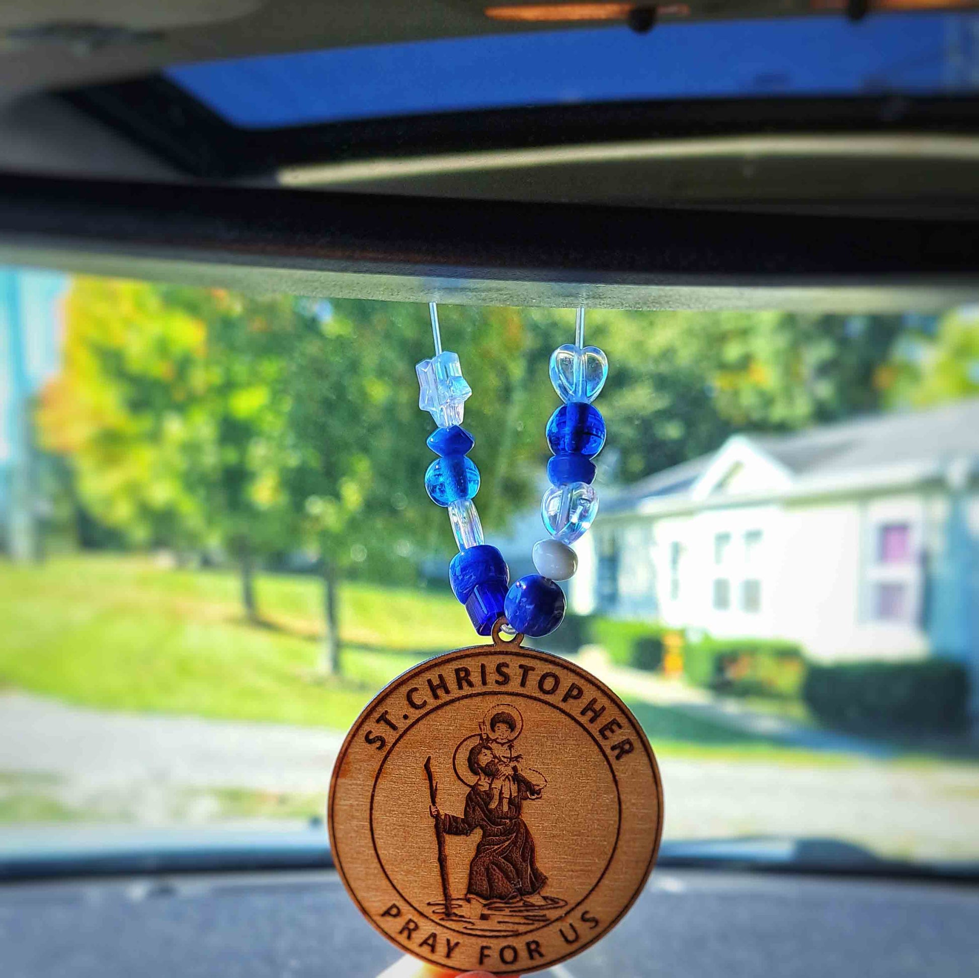 St. Christopher car charm with sword and scales for spiritual protection