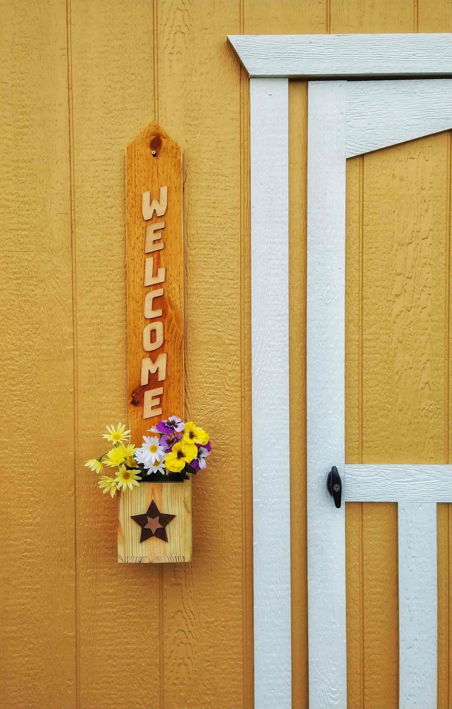 Welcome Sign Planter Box displayed with colorful flowers at home entrance